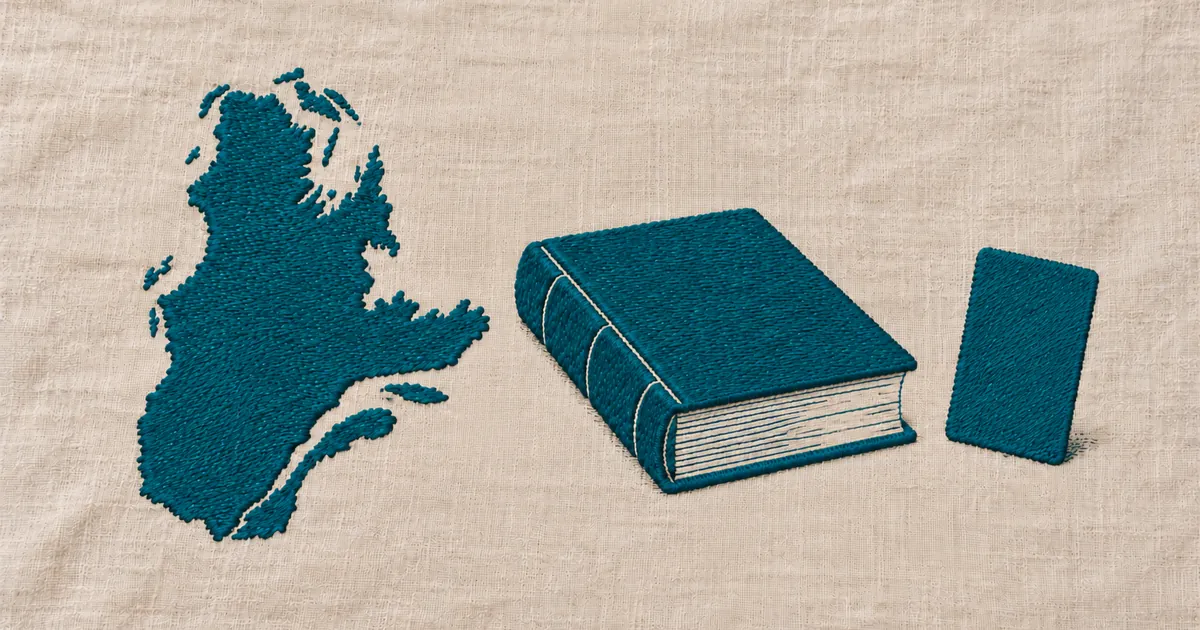 Embroidered outline of Quebec, a closed reference book and a blank card